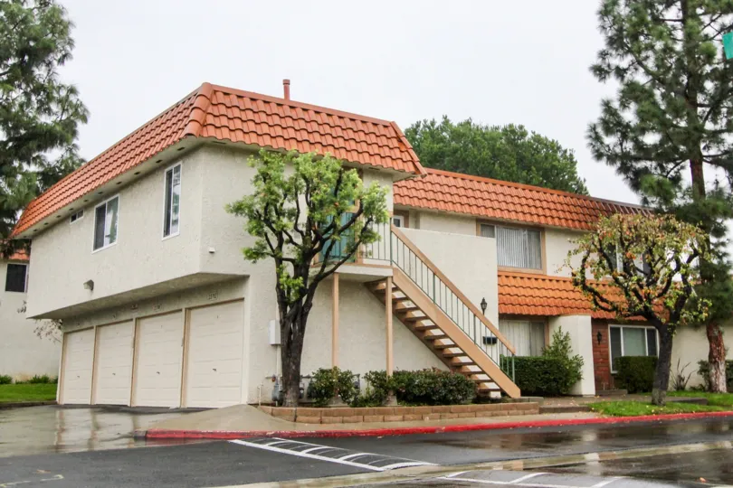 Nice view of a villa with trees and steps in Rancho Viejo Condos II of Lake Forest