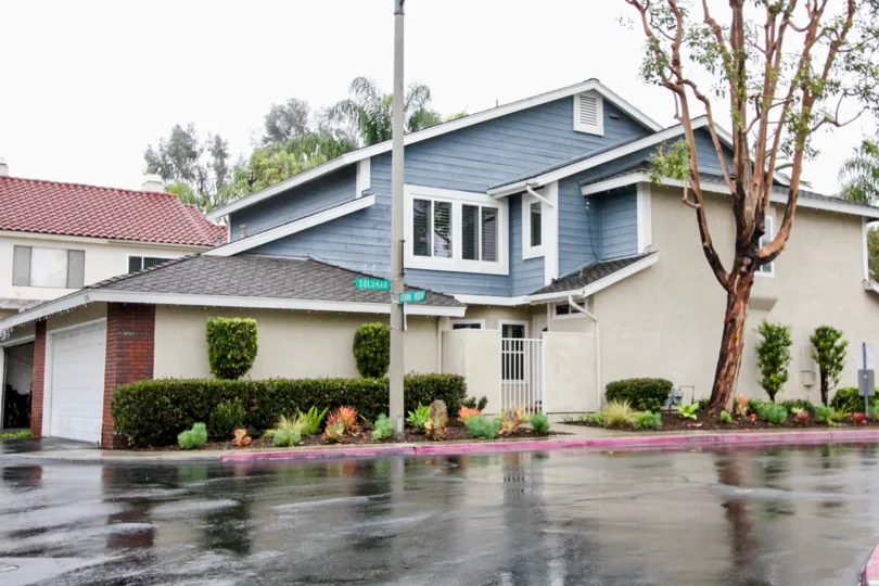 A Nice view of Villa on a rainy day with trees around in San Remo Villas of Lake Forest