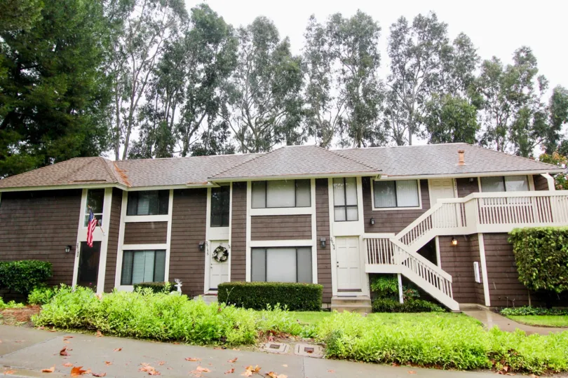 A big house is situated in front of some trees at Sycamore Glen.