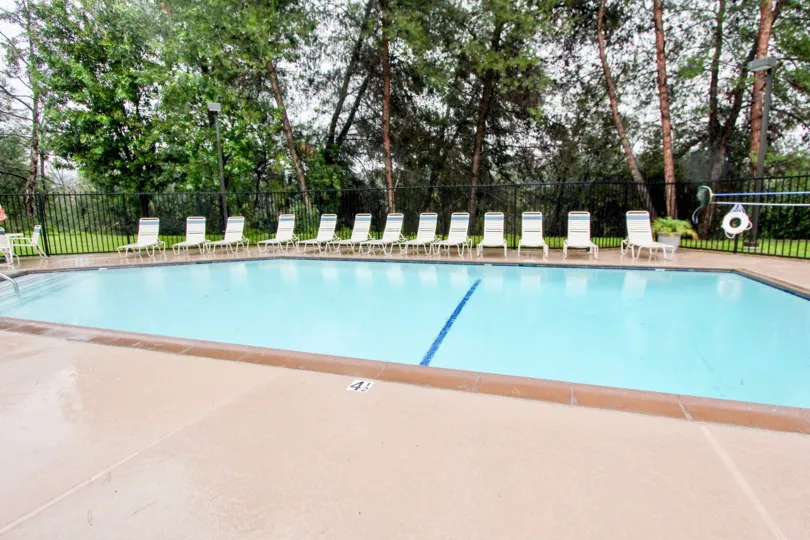 A pool with chairs around in at Sycamore Glen community in Lake Forest, California.
