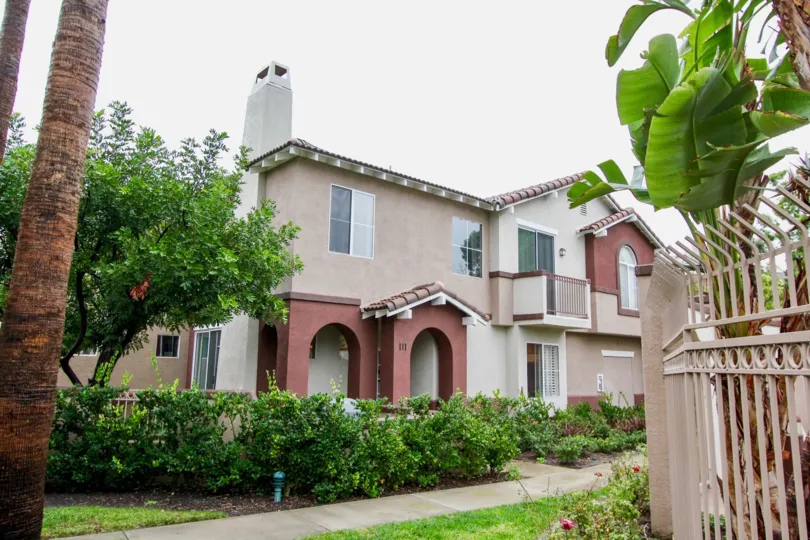 Fabulous view of villa with banana trees and chimney in The Vineyards of Lake Forest