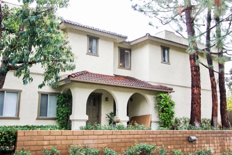 Hedges and brick wall at Tierra Vista in Lake Forest, CA
