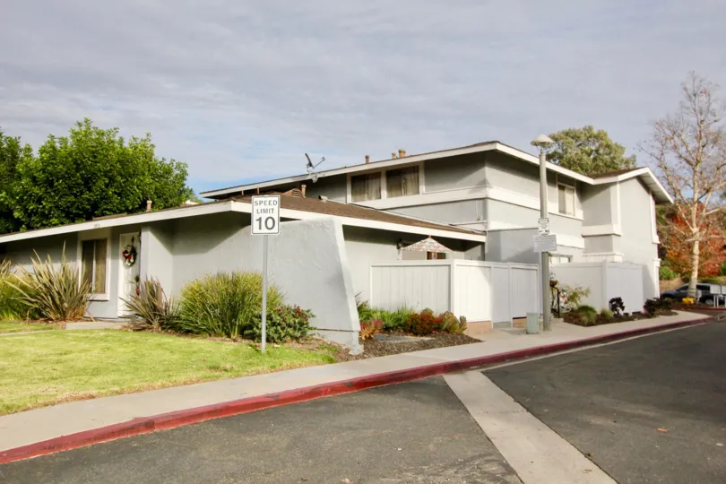 Grey color home with beautiful lawn and sloped roof in Aliso Villas.