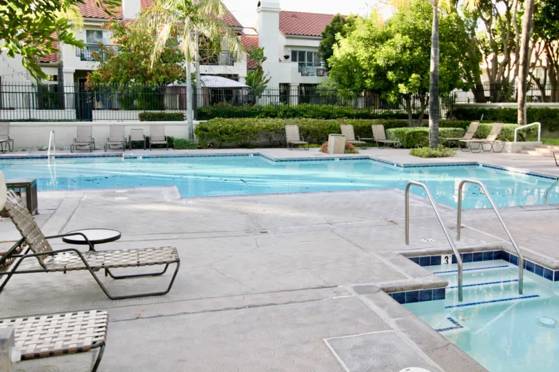 Double swimming pool with sun tan chairs in Coral Gardens.