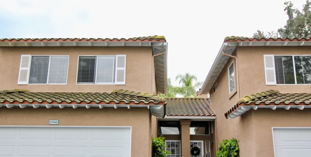 A house with verity windows in the Emerald Pointe II with plants.