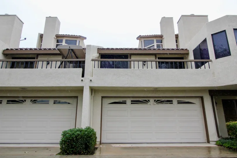 These Mediterranean style homes are located in a gated community of 214 low rise condos right on the mile long lake that is stocked annually with fish