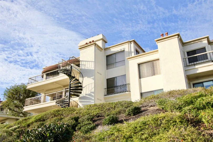 A bright day in the Mallorca Condos with a curly stair case.