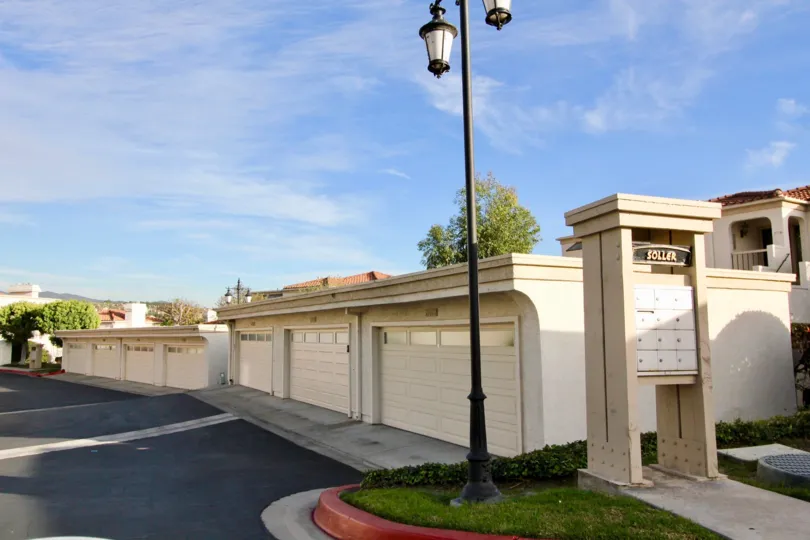 Bright Sunny Day with street lamps and parking near villas of Mallorca Condos of Mission Viejo