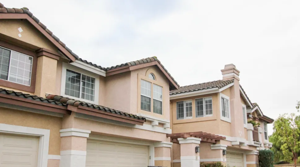 A house with glass windows in the Mirasol with tree.