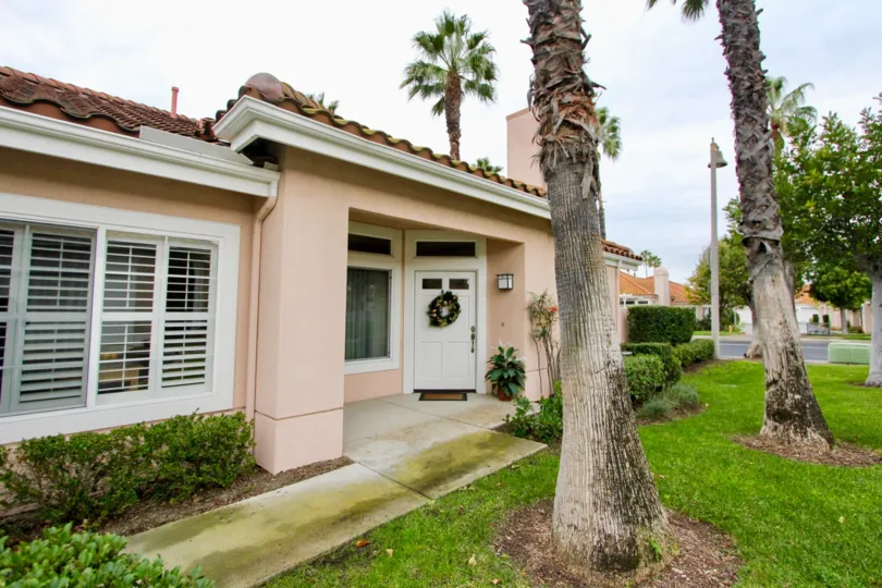 Trees and front door at Palmia Courts 2 in Mission Viejo, CA