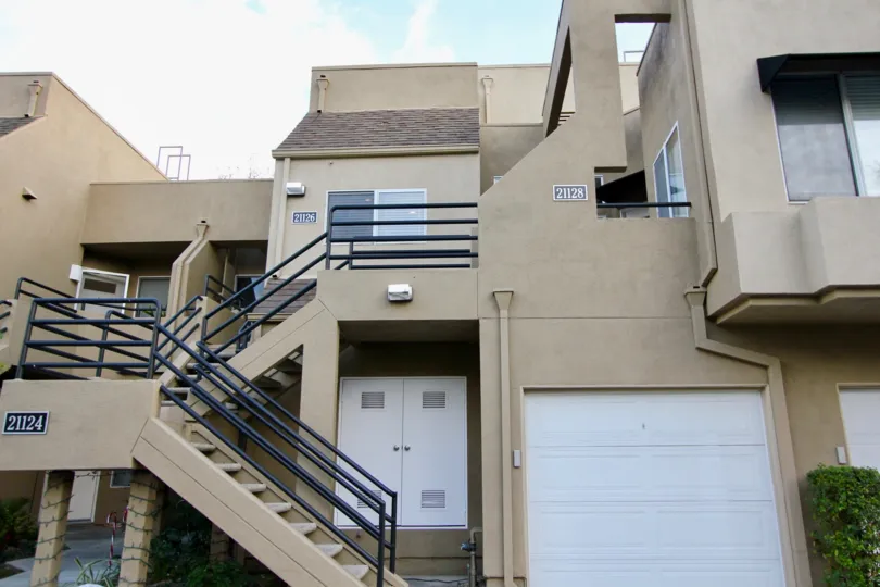 Two way stair case with iron railing and rolling windows in Rainbow Ridge.