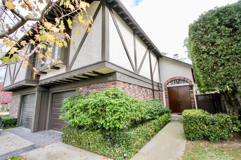 a warm day in the 16th & tustin with house that has tree on lief of garden