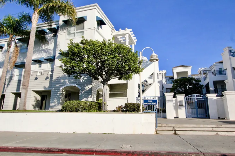 A beautiful day in the 28th Street Marina with a light in front of a apartment.