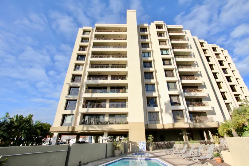 a sunny day in the lido park place with tall building of swiming pool
