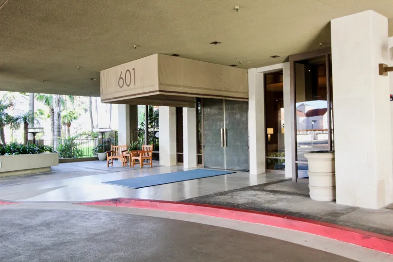 a warm day in the lido park place with park that has numbered 601 and glass door