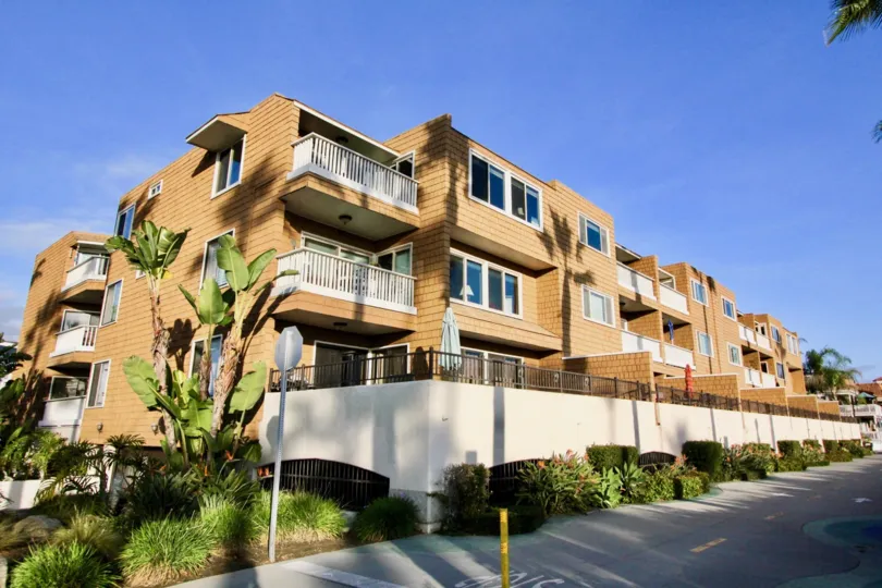 a sunny day in the balboa peninsula with a building that has too many flat and lenghty too