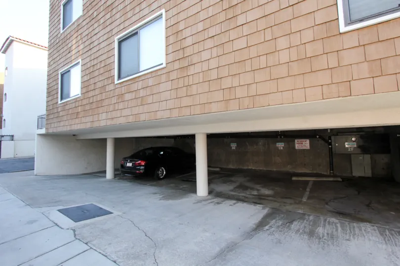 A beautiful day in the Balboa Peninsula with a car porch and car.