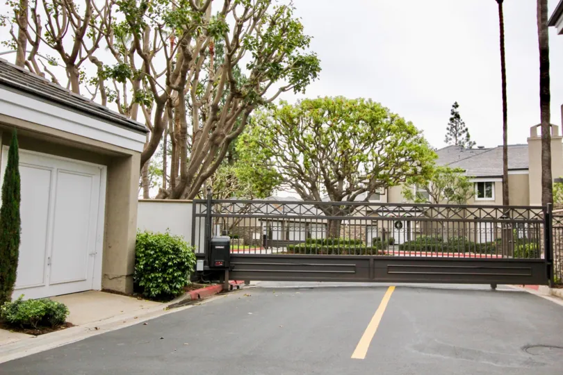 A day in the Bayview Court with some trees and a wooden gate.