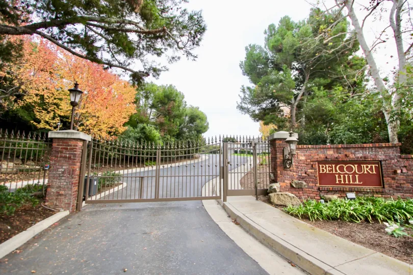 A great day in the Belcourt Hill with a gate and sign.