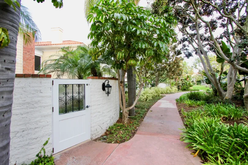 THE VILLAS IN THE BELCOURT TOWNE COLLECTION WITH THE PATHWAY, PLANTS, TREES, LIGHT