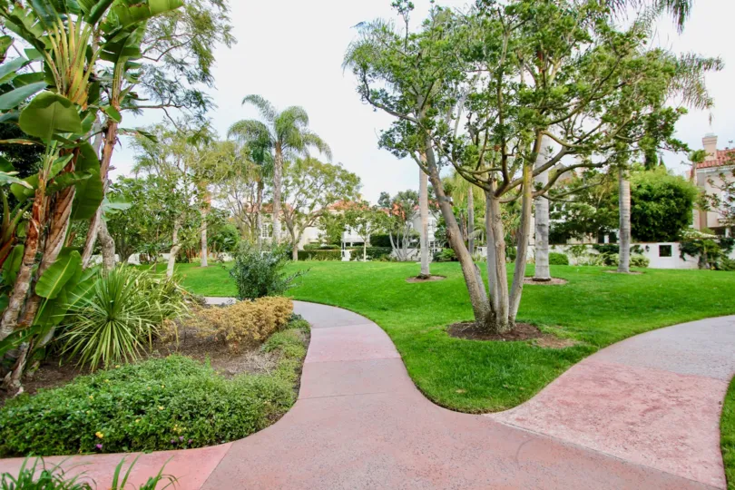 Lush lawns and inviting walkways at Belcourt Town Collection community in Newport Beach, CA