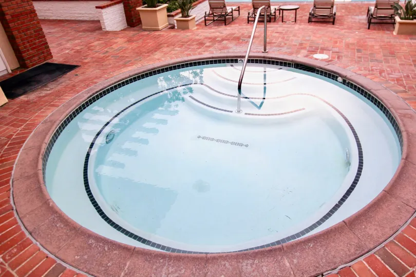 A great day in the Belcourt Towne Collection with a small swimming pool.