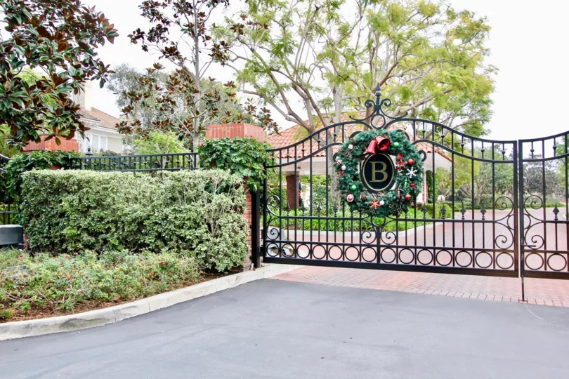 A day in the Belcourt Towne Collection with a iron gate and decorations.