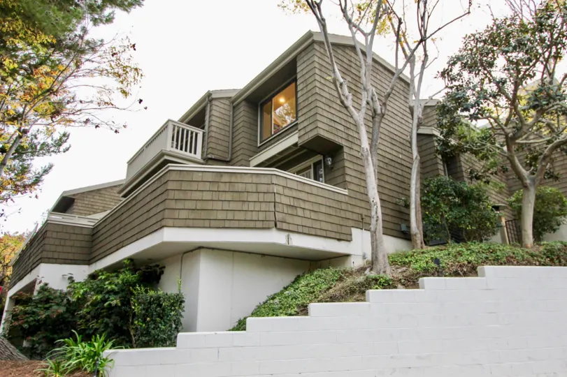 Side view with trees and plants of Big Canyon McLain community, Newport Beach, CA