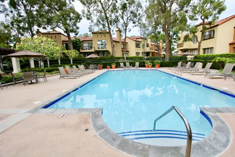 THE VILLAS IN THE BIG CANYON VILLAS WITH THE SWIMMING POOL, CHAIRS, TREES, PLANTS