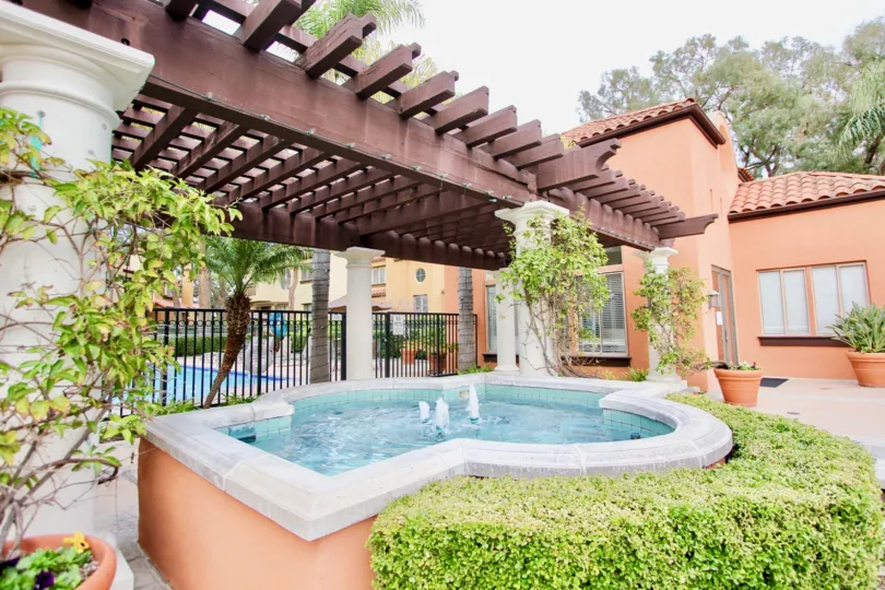 a warm day in the big canyon villas with house that has water land in the garden