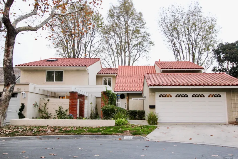 a warm day in the bluffs tennis villas with house that has roofless top and closed parking door