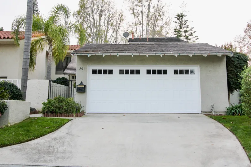 THE 501 APARTMENT IN THE BLUFFS TENNIS VILLAS WITH THE SHUTTER, LAWN, TREES, PLANTS