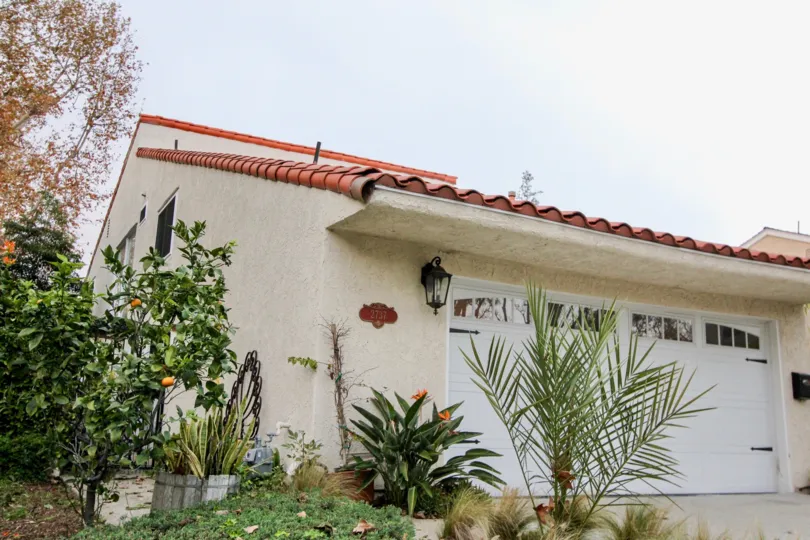 a warm day in the bluffs tennis villas with house that has door in color white and garden is right