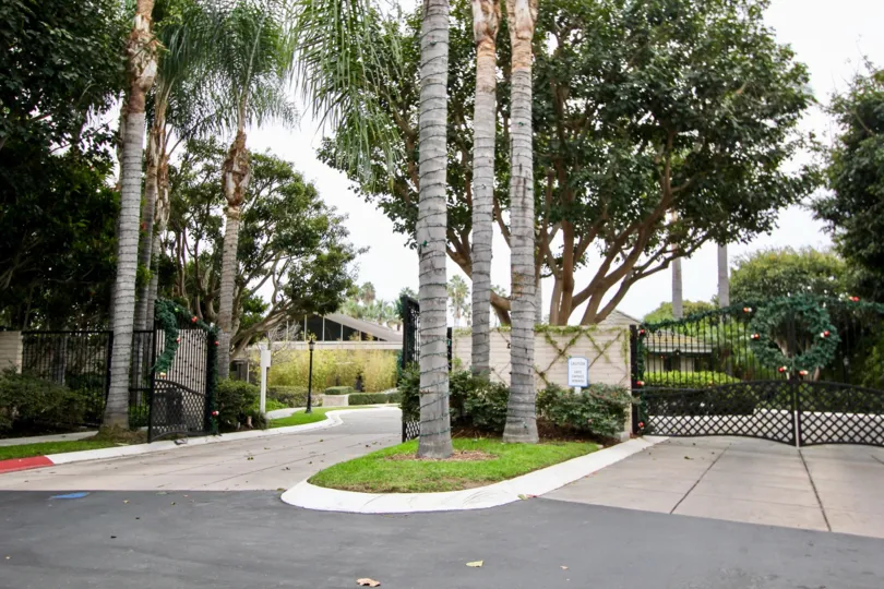 Christmas decorations adorn the black gates of the Granville community in Newport Beach, California.