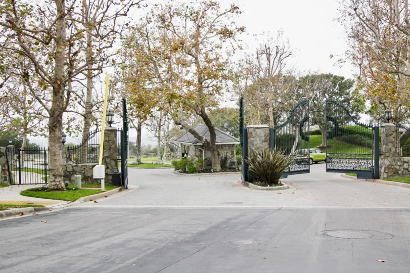 A great day in the Harbor Ridge Crest with a gate and trees.