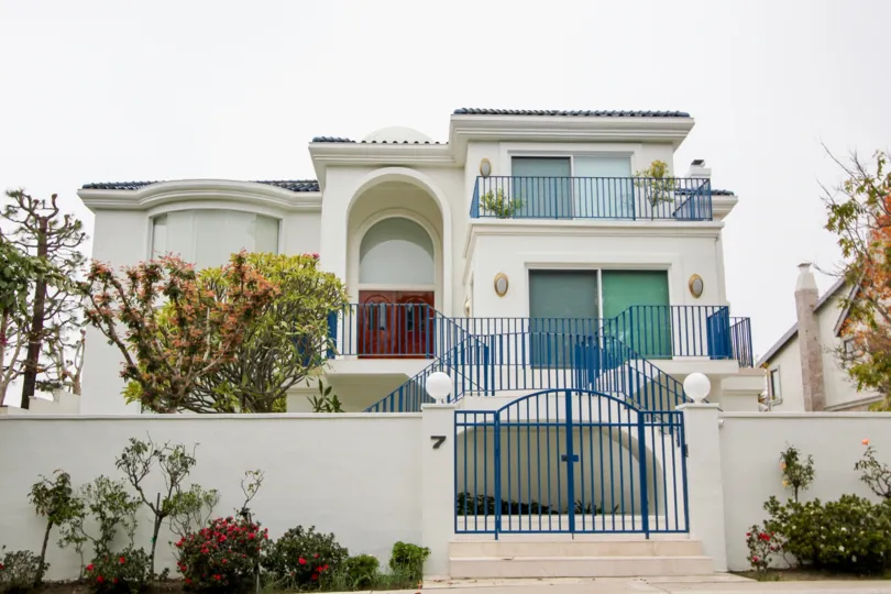 a warm day in the harbor ridge estates with house that has 4 storey and roof in top
