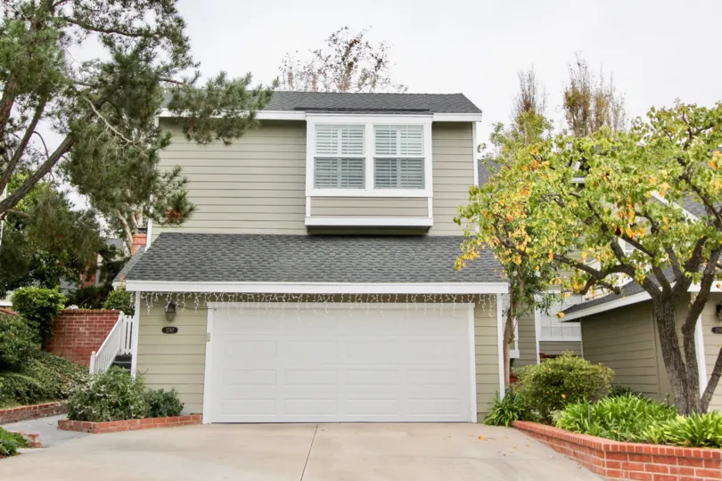 A garage of home at the Harbor View Knoll community in Newport Beach, California is decorated with Christmas lights.
