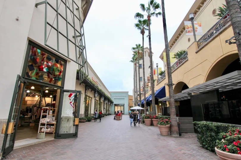 A sunny day in the Meridian with a street and store.