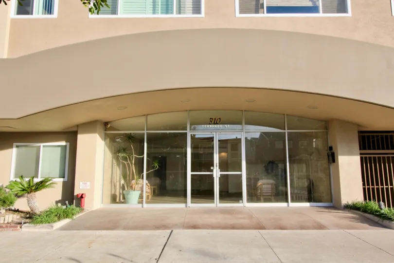 A day in the Newport Bay Towers with a entrance of a building.