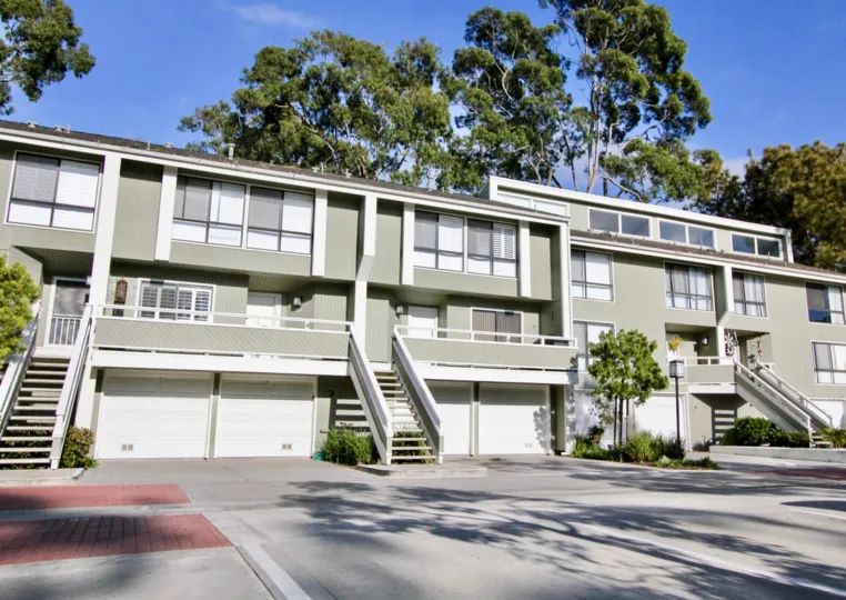 Apartment in Newport Crest with bushes, trees and stairs