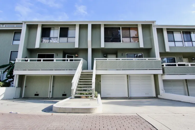 A sunny day in the Newport Crest with a terrace and clear sky.