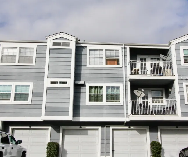 a warm day in the newport knolls with house that has 2 storey of dish and 4 white doors