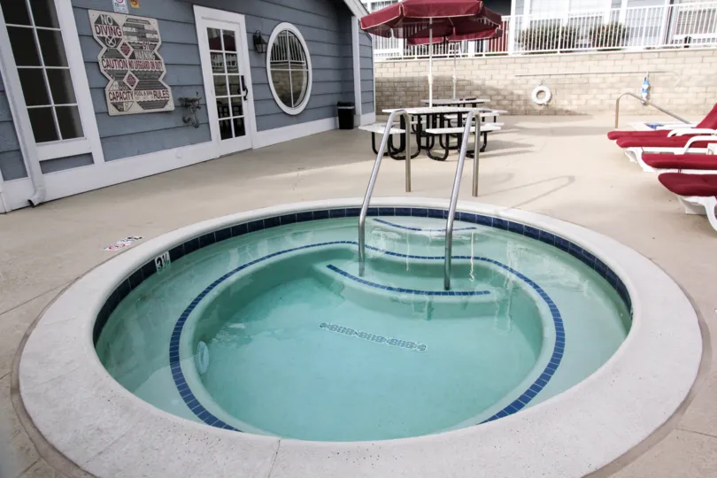 Inside the Villa in Newport Knolls has Children's Swimming Pool with Chairs and dinning tables