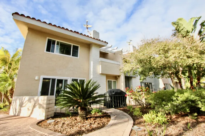 Beautiful front view of the Newport Marina Villas on a sunny day in Newport Beach, CA