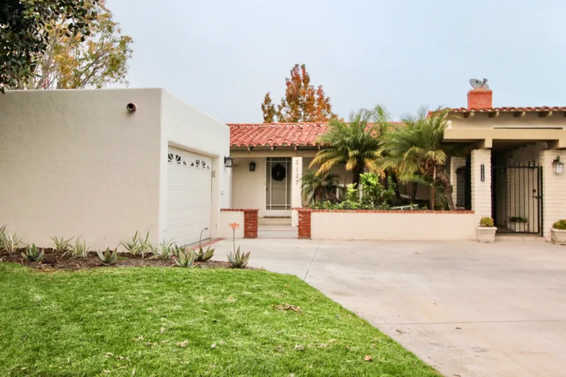 A day in the Bluffs with a beautiful lawn and nice house.