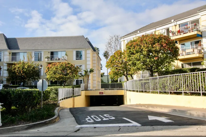 a warm day in the versailles with house that has front in gardens and road to stop in arrow