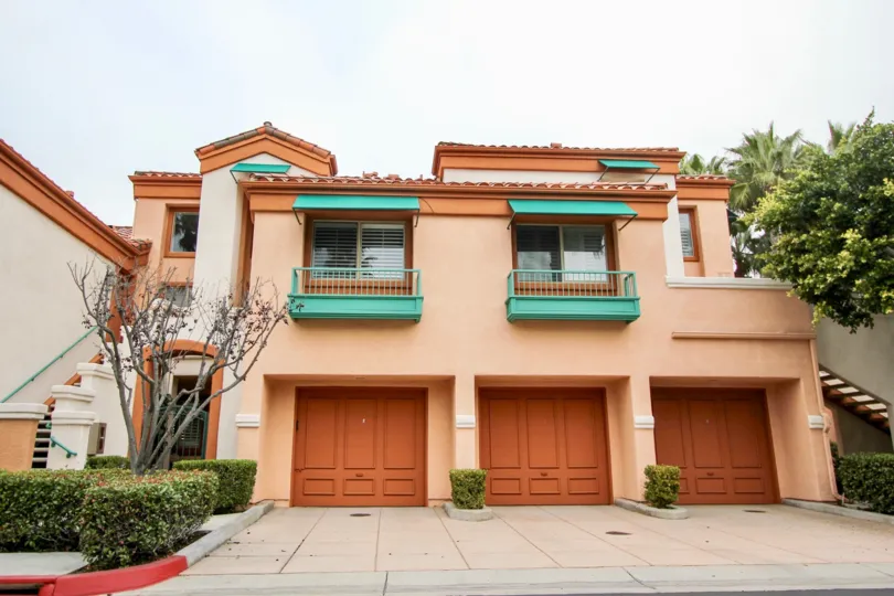 a warm day in the villa point with a house that has door in brown colour with entrance in the side