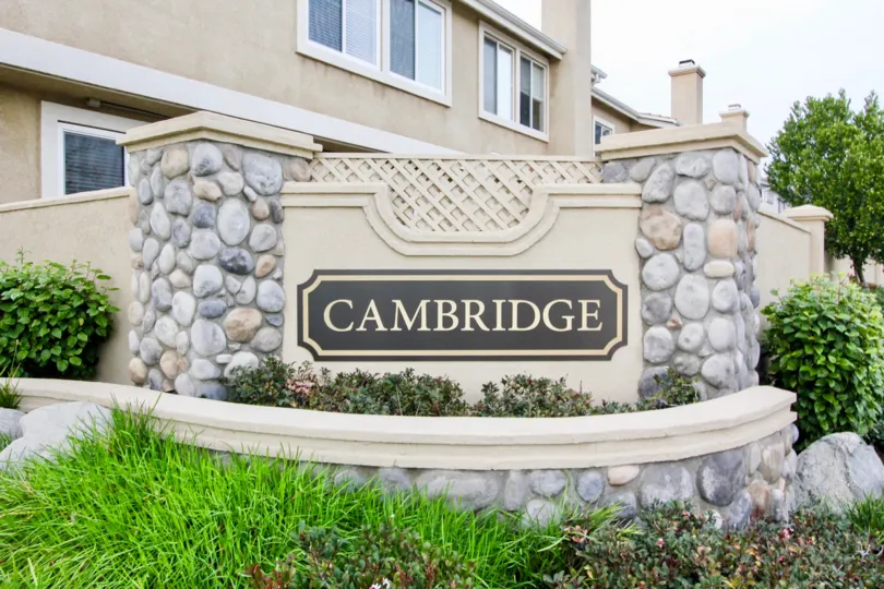 Beautiful garden entrance with bushes, flowers, and three tiers of plants