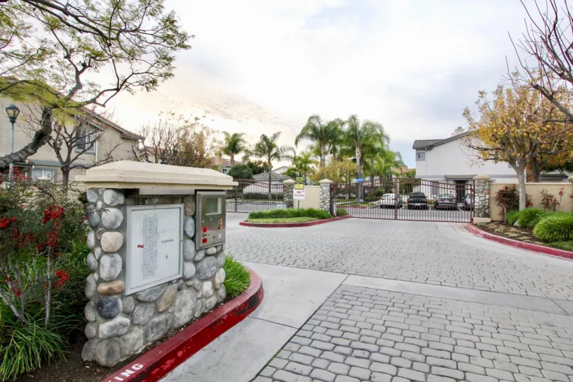The Cambridge community in Orange, California decorated with flowers and bushes.