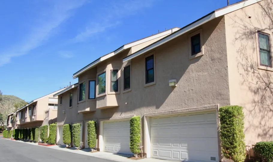 Beautiful neighborhood house with two stories and a lush green front yard